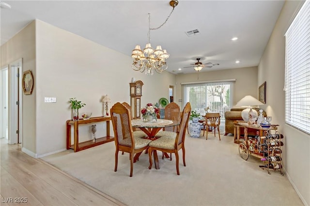 dining room with recessed lighting, ceiling fan with notable chandelier, visible vents, baseboards, and light wood-type flooring