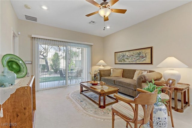 living room with a ceiling fan, light colored carpet, visible vents, and recessed lighting