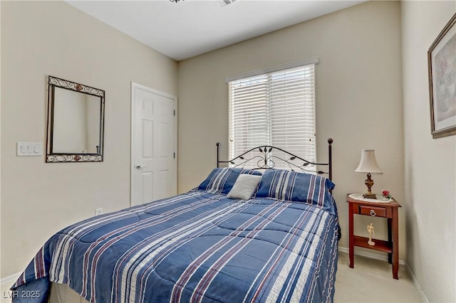 carpeted bedroom featuring baseboards