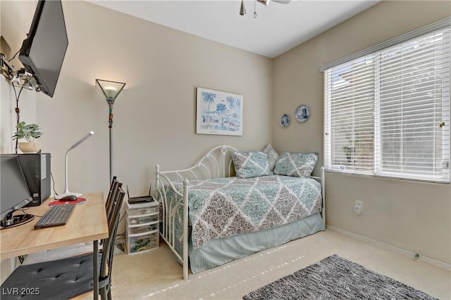 carpeted bedroom with baseboards