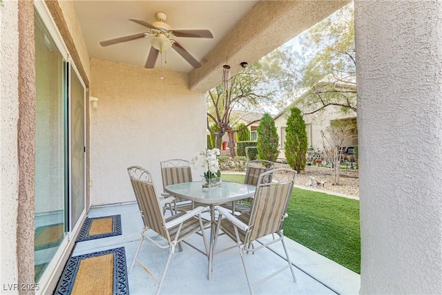 view of patio / terrace with outdoor dining space and ceiling fan