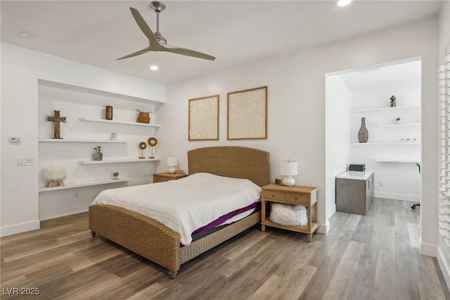 bedroom with a ceiling fan, baseboards, wood finished floors, and recessed lighting