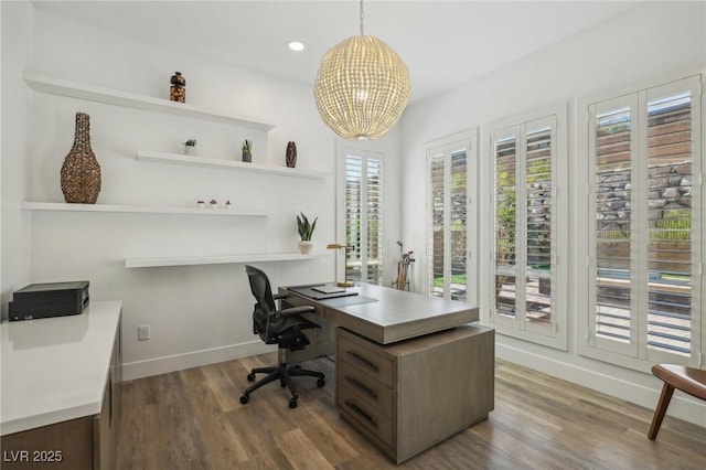 home office with recessed lighting, an inviting chandelier, wood finished floors, and baseboards