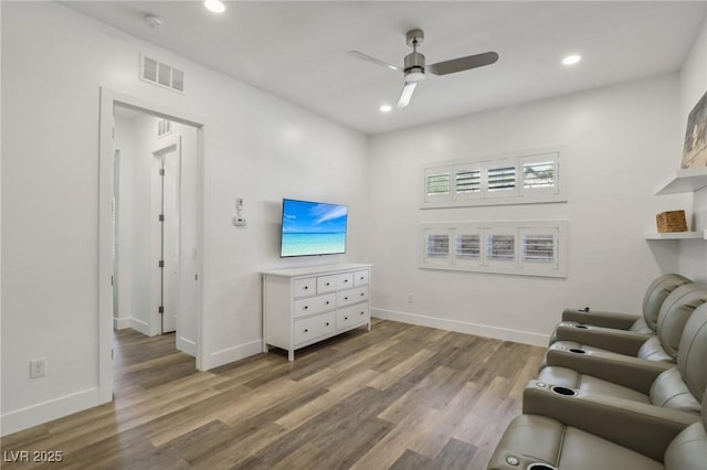 interior space with light wood-style floors, recessed lighting, visible vents, and baseboards