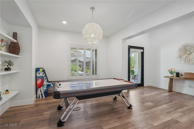 game room featuring baseboards, a chandelier, wood finished floors, and recessed lighting