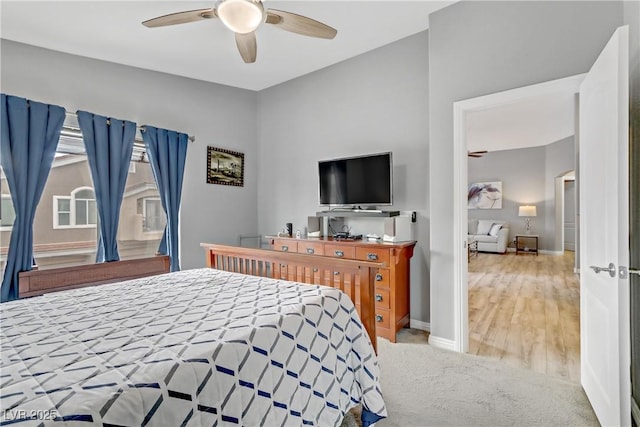 bedroom with carpet flooring, a ceiling fan, and baseboards