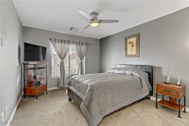 bedroom with a ceiling fan, visible vents, light carpet, and baseboards