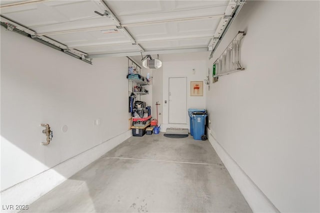 garage featuring a garage door opener