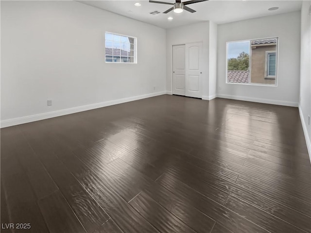 unfurnished room with dark wood-type flooring, recessed lighting, baseboards, and ceiling fan