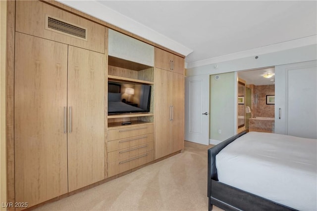 bedroom featuring visible vents and connected bathroom