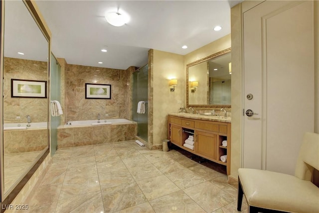 full bath with a garden tub, recessed lighting, a sink, double vanity, and a stall shower