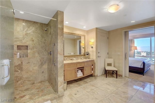 bathroom with a stall shower, ensuite bath, and vanity