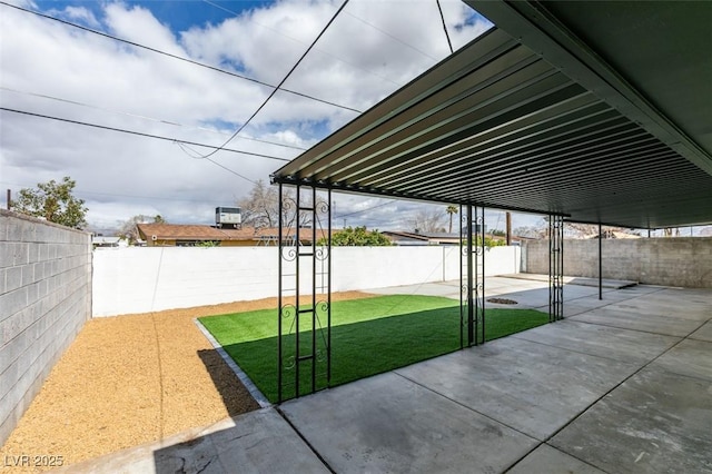 view of yard with a patio area and a fenced backyard