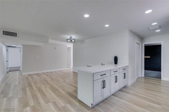 kitchen with recessed lighting, visible vents, light wood-style floors, and light countertops