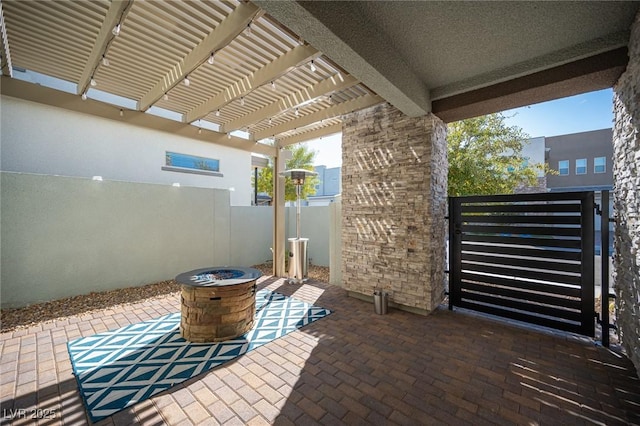 view of patio with an outdoor fire pit, fence, and a pergola