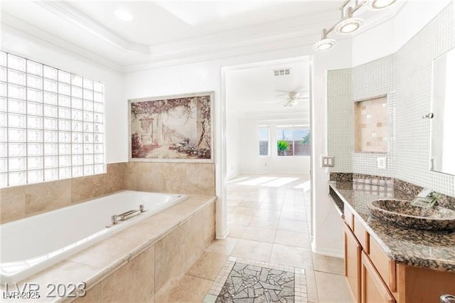 full bathroom featuring visible vents, tile patterned floors, a garden tub, crown molding, and vanity