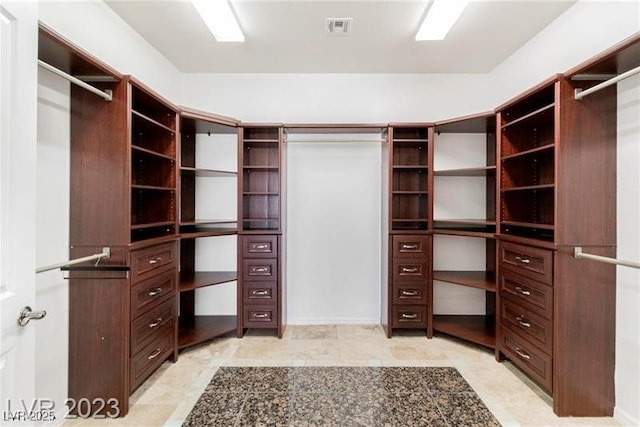 spacious closet featuring visible vents