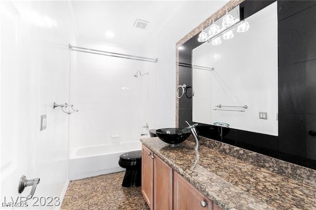 bathroom featuring shower / bath combination, vanity, and toilet