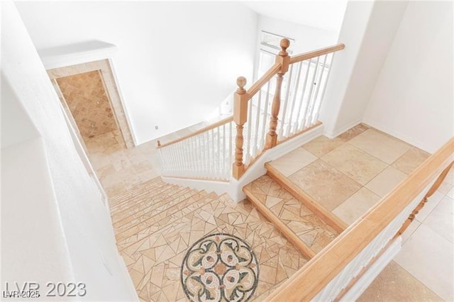 stairs with tile patterned floors