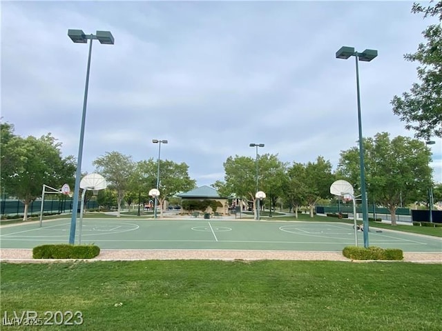 view of sport court featuring community basketball court and a lawn