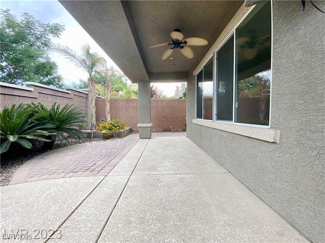 view of patio / terrace featuring a fenced backyard and a ceiling fan