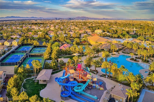 birds eye view of property with a residential view and a mountain view