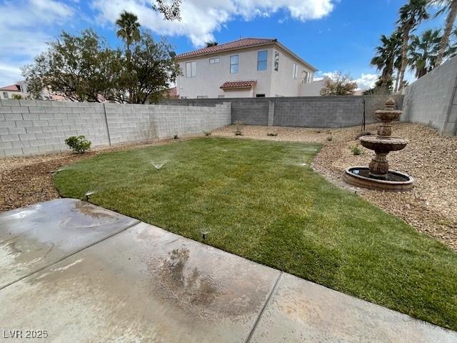 view of yard with a fenced backyard