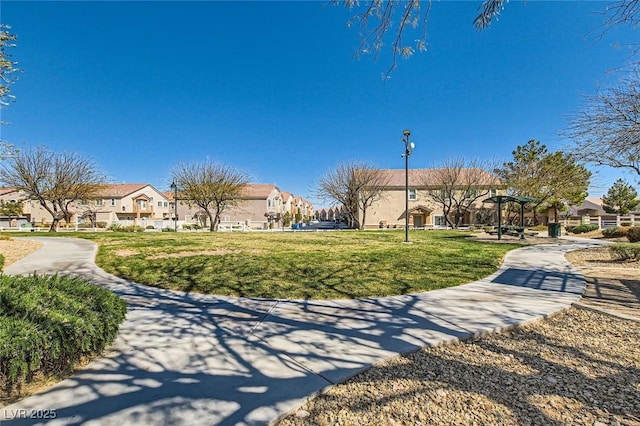 view of property's community with a yard and a residential view