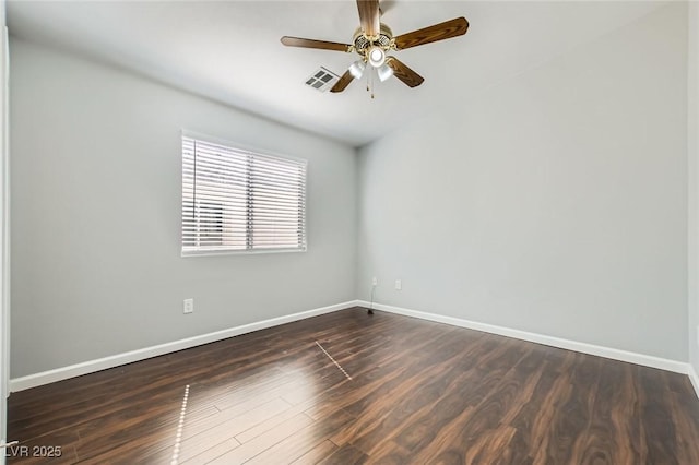 unfurnished room with visible vents, a ceiling fan, baseboards, and dark wood-style flooring