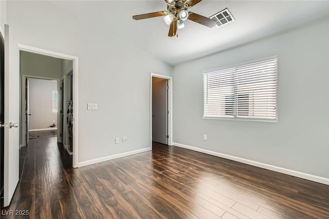 unfurnished bedroom with a ceiling fan, wood finished floors, visible vents, baseboards, and lofted ceiling