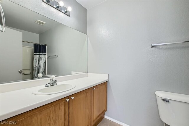 full bath featuring visible vents, toilet, a shower with shower curtain, tile patterned floors, and vanity