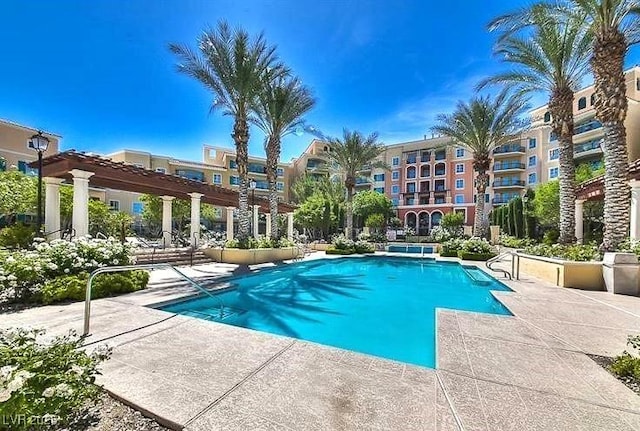 community pool with a patio area