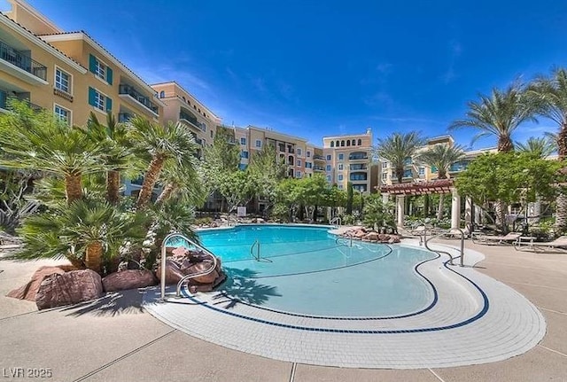 community pool featuring a pergola and a patio