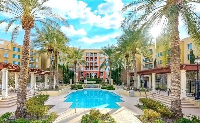 view of swimming pool featuring a pergola