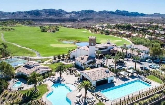 bird's eye view featuring golf course view and a mountain view