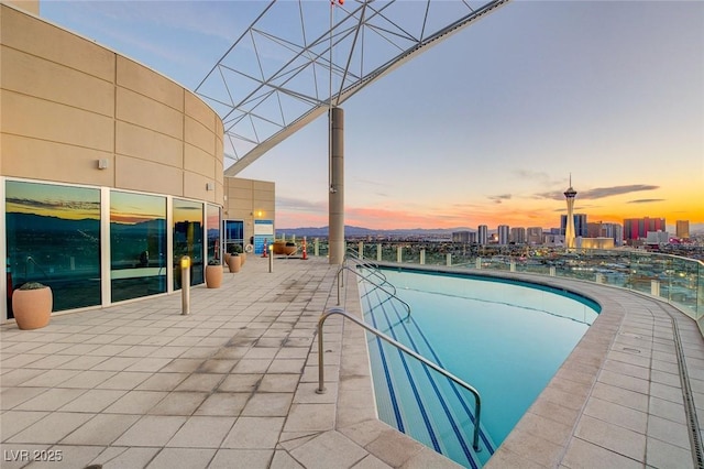 view of swimming pool with a city view