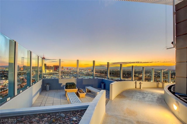 view of patio featuring a view of city and a balcony