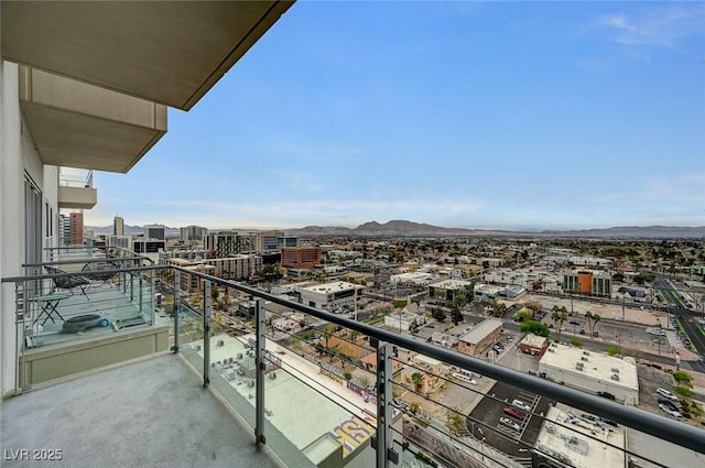 balcony with a view of city and a mountain view