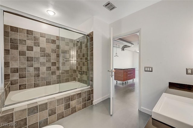 full bath with tiled shower / bath combo, visible vents, and concrete floors