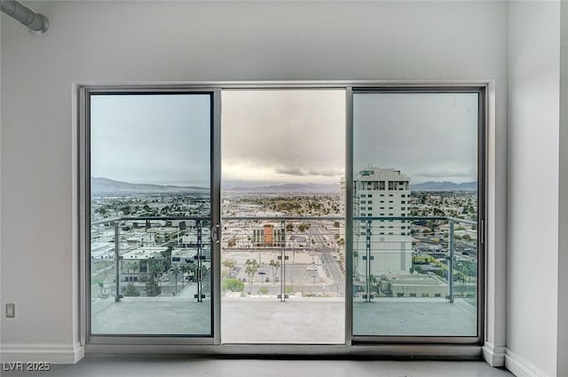 entryway with a city view and baseboards