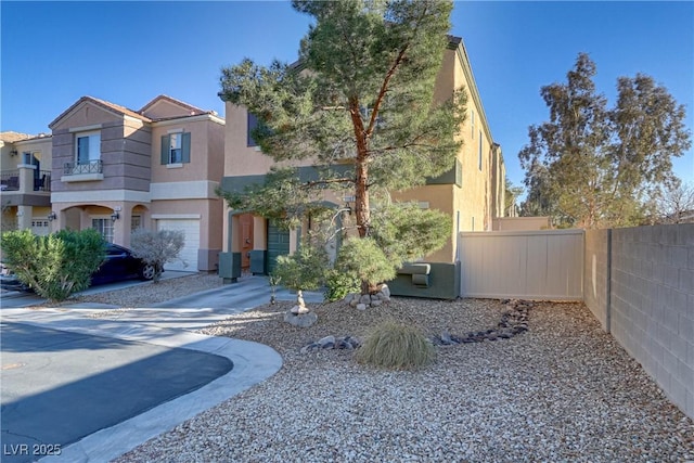 view of front of property featuring fence and stucco siding