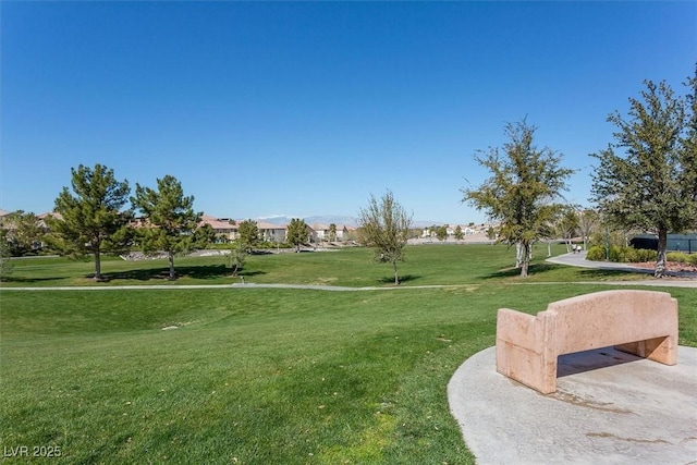 view of home's community featuring a lawn