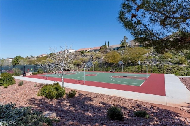 view of basketball court with community basketball court and fence