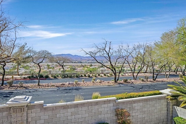 view of swimming pool with a mountain view