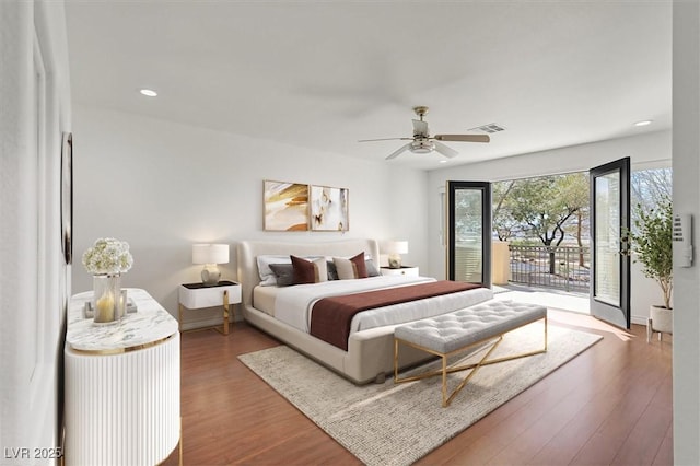bedroom with wood finished floors, visible vents, recessed lighting, ceiling fan, and access to outside
