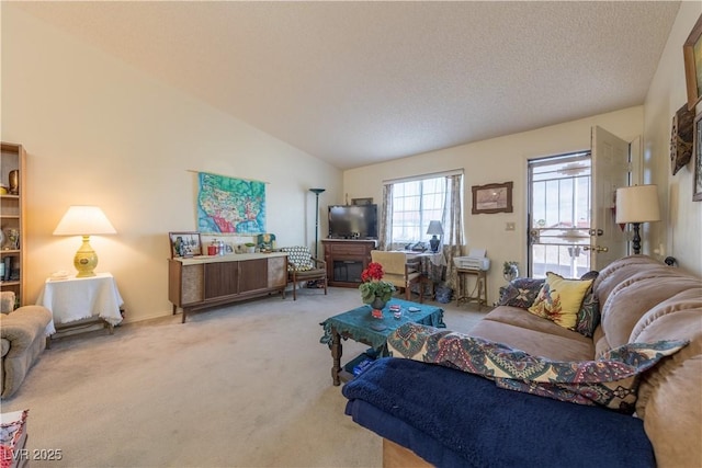 1892 Maricopa Dr, Laughlin, NV 89029 - carpeted living room featuring lofted ceiling and a textured ceiling