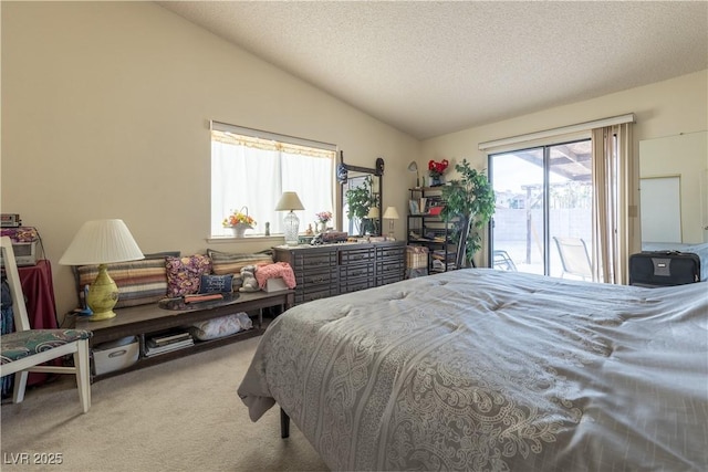 1892 Maricopa Dr, Laughlin, NV 89029 - bedroom with access to exterior, a textured ceiling, vaulted ceiling, and carpet flooring