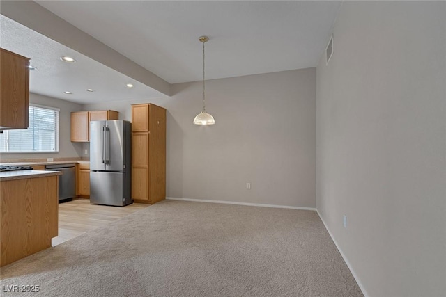 kitchen with recessed lighting, hanging light fixtures, appliances with stainless steel finishes, light carpet, and baseboards