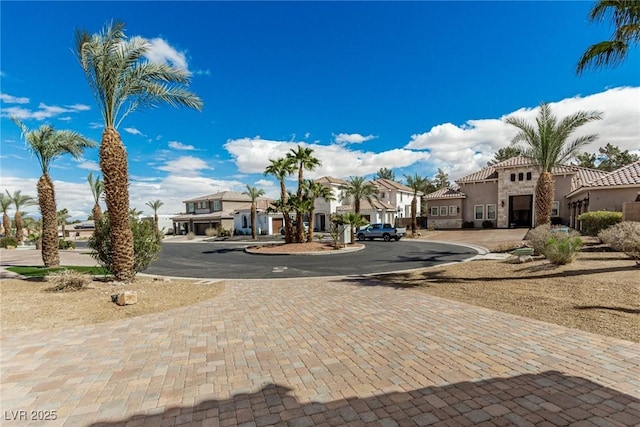 view of street with a residential view and driveway