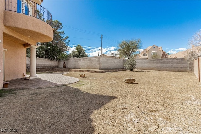 view of yard featuring a patio area and a fenced backyard